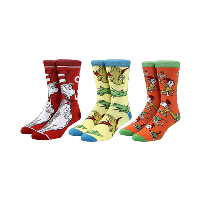 Three pairs of crew socks featuring Dr. Seuss characters. The Cat in the Hat is on red socks, fish are on yellow socks, and Green Eggs and Ham characters are on orange socks.