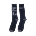 Close-up of a pair of navy blue socks with The Office logo and white stripes.