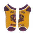 Close-up of a pair of gold D&D socks with 'Roll for Initiative' and a D20.