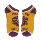 Close-up of a pair of gold D&D socks with 'Roll for Initiative' and a D20.