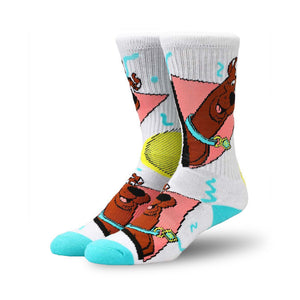 white crew socks with a pattern of scooby-doo in various poses on a pink, blue, and yellow background.   