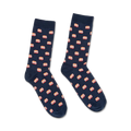 Pair of navy blue crew socks with a repeating pattern of illustrated stacks of books in coral and white. 