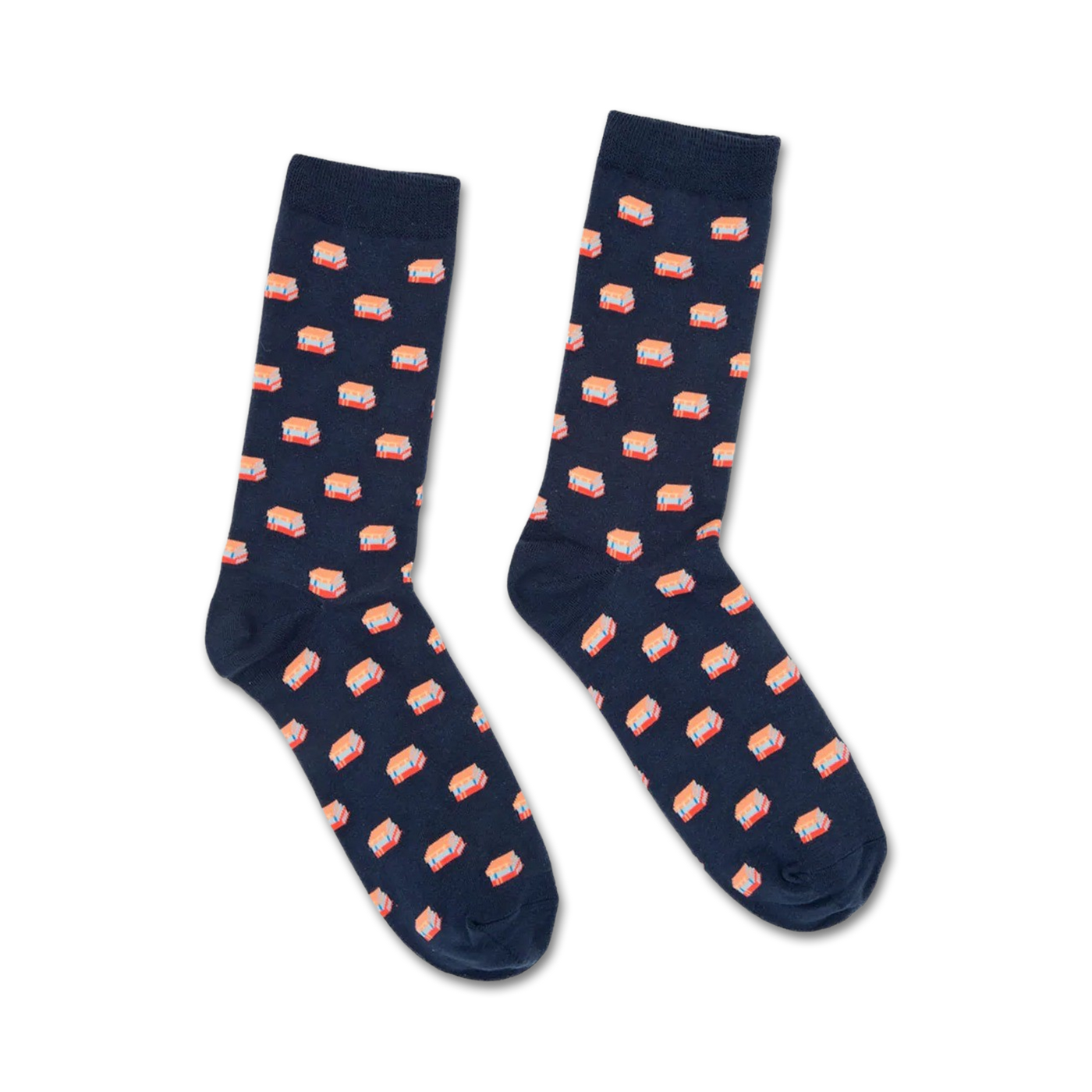 Pair of navy blue crew socks with a repeating pattern of illustrated stacks of books in coral and white. 