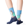 Back view lifestyle shot of a person wearing the socks against a dark grey background.