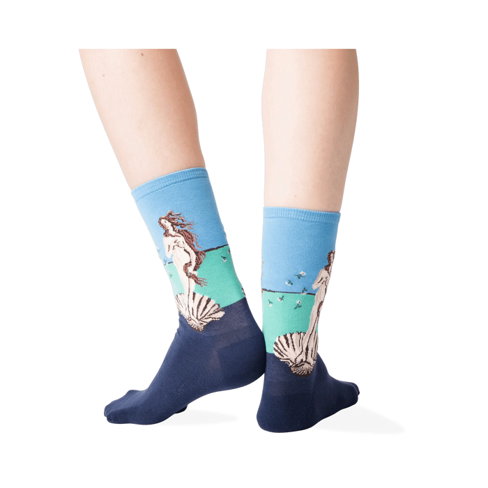 Back view lifestyle shot of a person wearing the socks against a dark grey background.