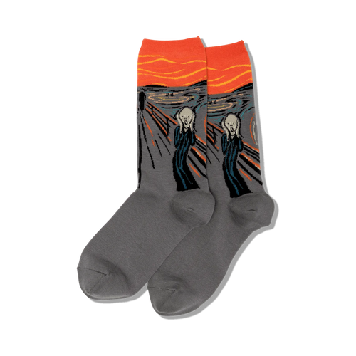 Lifestyle shot of The Scream socks on a person's feet surrounded by fall flowers.