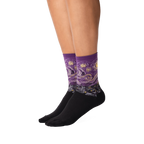 Lifestyle shot: A person's legs wearing a pair of purple Van Gogh's Starry Night socks.