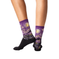 Back view of a person wearing purple Van Gogh's Starry Night socks, showcasing the sock's fit and design.