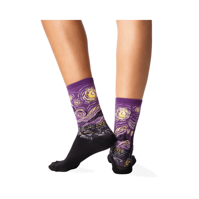 Back view of a person wearing purple Van Gogh's Starry Night socks, showcasing the sock's fit and design.