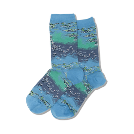 monet's waterlilies socks for women feature an all-over pattern of water lilies in shades of blue, green, and pink on a light blue background. the socks are blue at the top and the toes are dark green.  