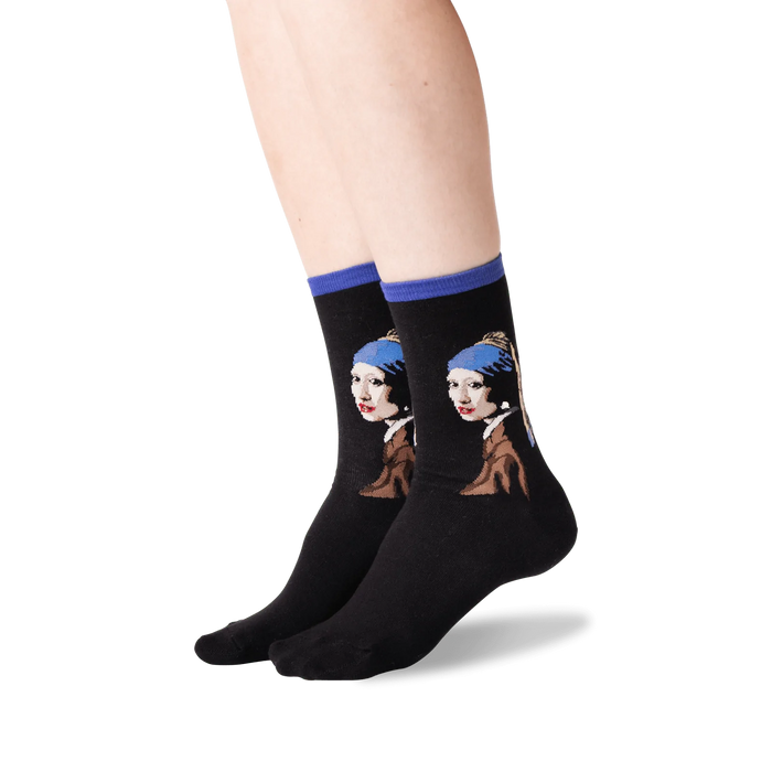 A pair of black socks with a colorful pattern of a painting of a woman with a pearl earring on each sock.