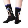 Back view of the 'Girl With A Pearl Earring' socks on a person's legs, showing the sock's fit and design details.