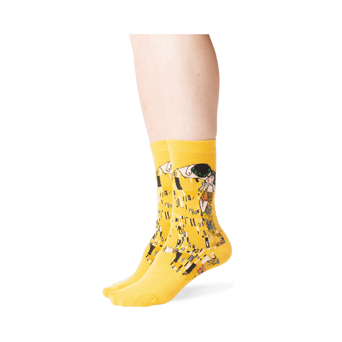 Close-up shot of Klimt's The Kiss socks on a person's legs, showing detail and fit.