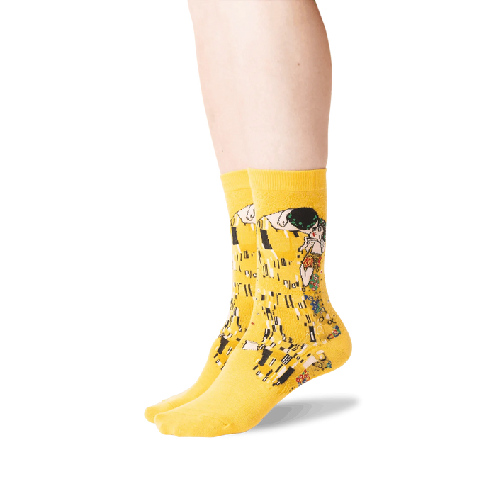 A pair of yellow socks with a painting of 