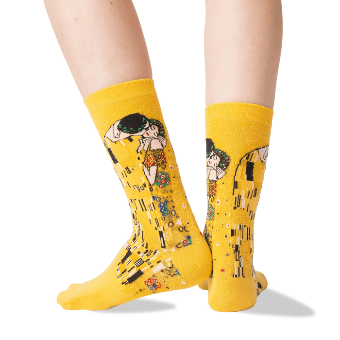 A pair of yellow socks with a painting of 