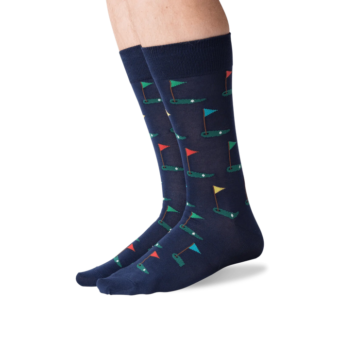 A pair of blue socks with a pattern of multi-colored golf flags.