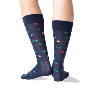 A pair of blue socks with a pattern of multi-colored golf flags.