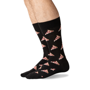 A pair of black socks with a pattern of pizza slices.