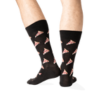Rear view of the black pizza socks on a model, displaying the pizza pattern on the back of the socks.