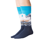 Lifestyle shot of model wearing Hokusai's Great Wave socks, showcasing the fit and design on legs.