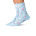 Pair of feet wearing light blue socks with white and pink wedding cake patterns, shown against a white background.