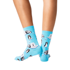 Back view of a person wearing blue Old English Sheepdog crew socks.