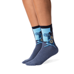 Lifestyle photo showing Picasso's Old Guitarist socks on a person's legs, showcasing how the socks look when worn.