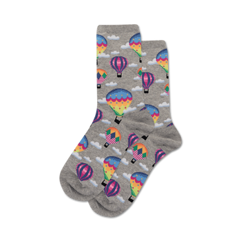Pair of grey crew socks with a fun pattern of colorful hot air balloons and white clouds.