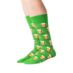 Flat lay showing a pair of green beer mug socks.