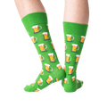 Close-up detail shot of green beer mug socks, showing the pattern.
