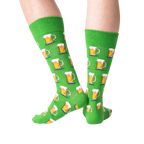 Close-up detail shot of green beer mug socks, showing the pattern.