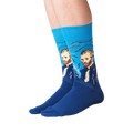 Lifestyle shot of a person wearing the Van Gogh's Self Portrait socks against a black background.