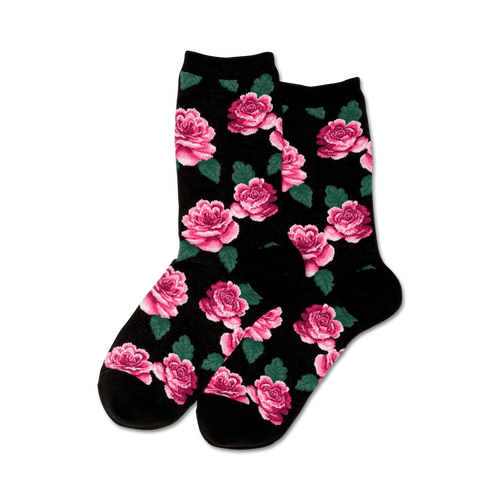 Pair of crew socks with a pink rose and green leaf pattern on a black background. 