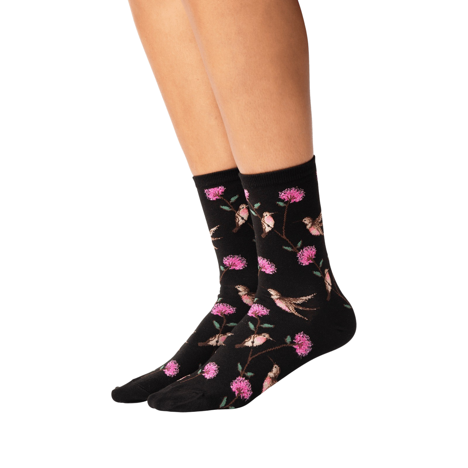 Lifestyle shot of woman's legs wearing black crew socks with hummingbird pattern.