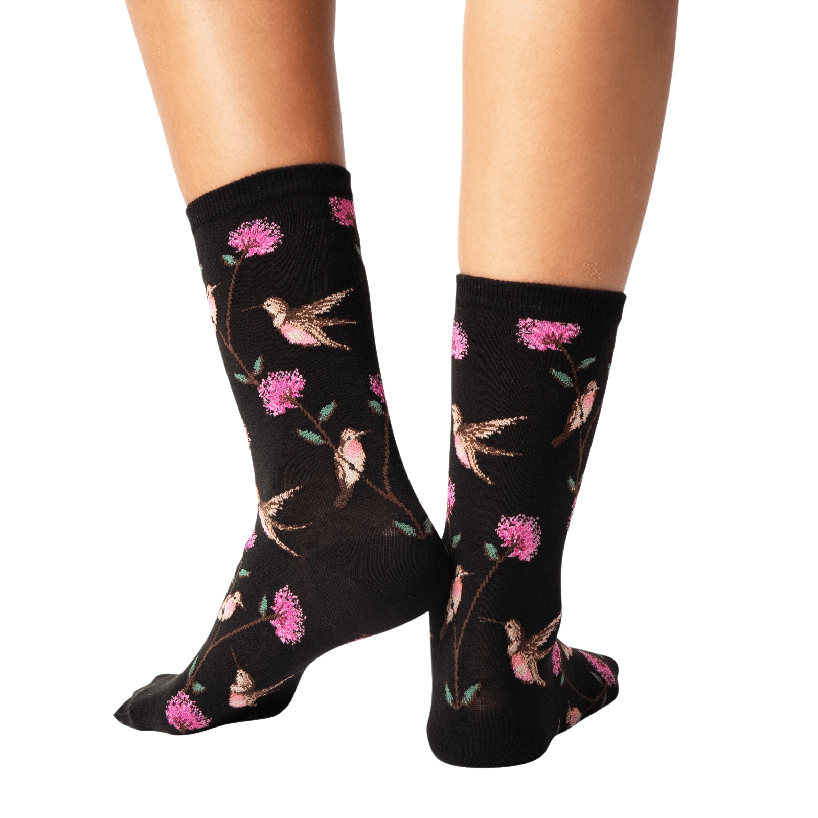Back view of a pair of black crew socks with a hummingbird and flower pattern.