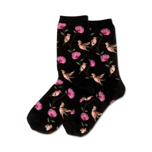 Pair of black crew socks with a whimsical pattern of pink flowers and hummingbirds.