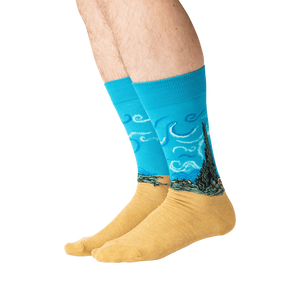 Lifestyle shot: A person's legs wearing the Van Gogh's Wheat Field with Cypress socks.
