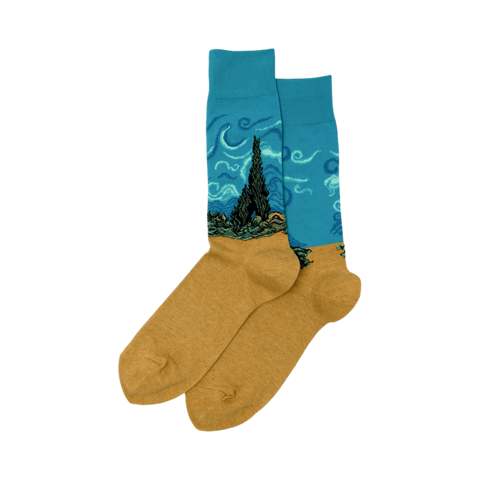 Pair of crew socks. Teal blue upper section features Van Gogh's Wheat Field with Cypress painting. Mustard yellow lower section. 