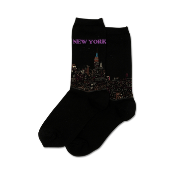 black women's crew socks with a vibrant pattern of the new york city skyline in bright colors.  