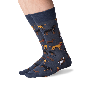 A pair of blue socks with a pattern of various breeds of dogs.