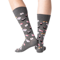 Studio shot of a pair of gray sushi socks from the back, showcasing the full print.