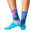 Back view of the Monet's Houses of Parliament at Sunset socks on a person's legs.