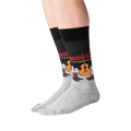 Lifestyle shot of a person wearing a pair of Nashville-themed socks.