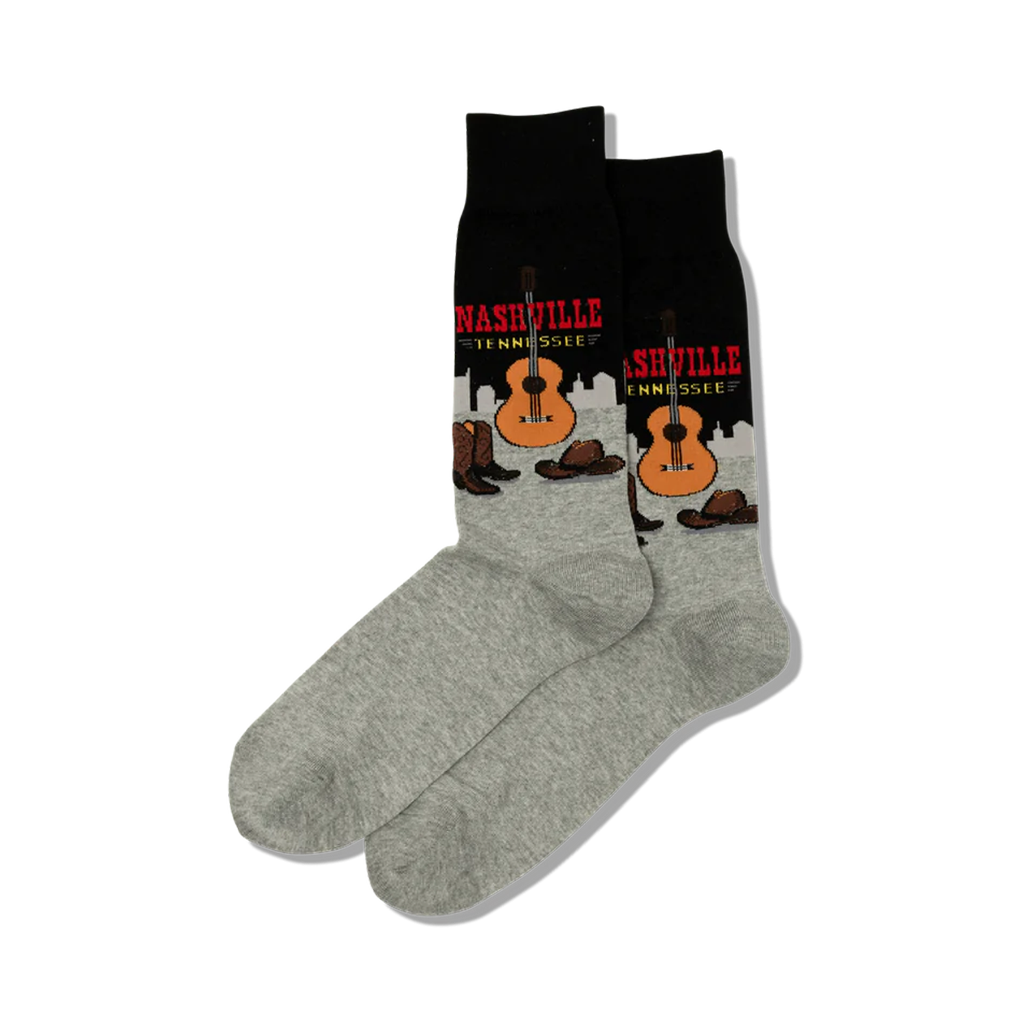 Pair of crew socks; black and grey with a Nashville, Tennessee design featuring a guitar, cowboy boots, and hats.