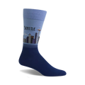 Crew socks in light and dark blue shades, featuring a Seattle skyline graphic including the Space Needle.
