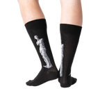 Back view of the Venus de Milo socks on a person's legs, showing the full design on the back of each sock.