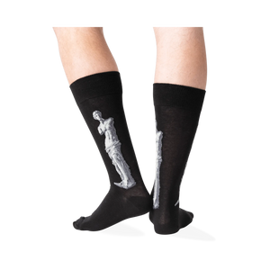 Back view of the Venus de Milo socks on a person's legs, showing the full design on the back of each sock.