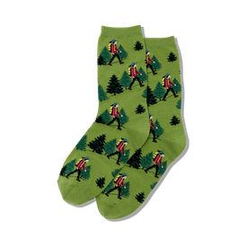 green crew socks with a pattern of a person hiking and pine trees.   