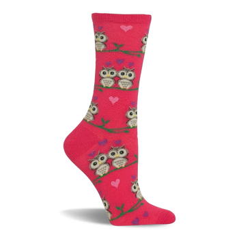 Pink crew sock with a pattern of cartoon owls, some in pairs, sitting on green branches. Small pink and purple hearts are scattered.