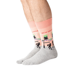 Lifestyle shot of a person wearing the New Orleans socks, showcasing how they look when worn.
